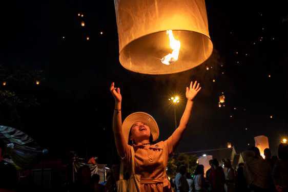 Girl letting go a latern